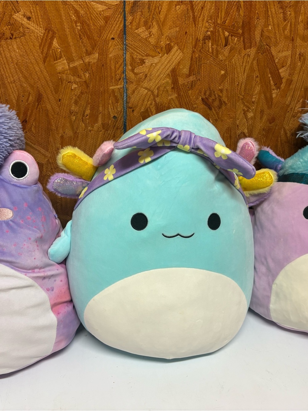 Squishmallows Aqua Blue and White Narwhal with Purple Floral Headband